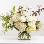 Serene White Blooms arrangement in Glass Vase