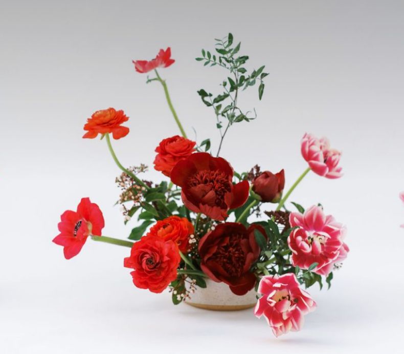 About goshen flower -red roses, tulips and greenary arrangement goshen flower delivery dubai